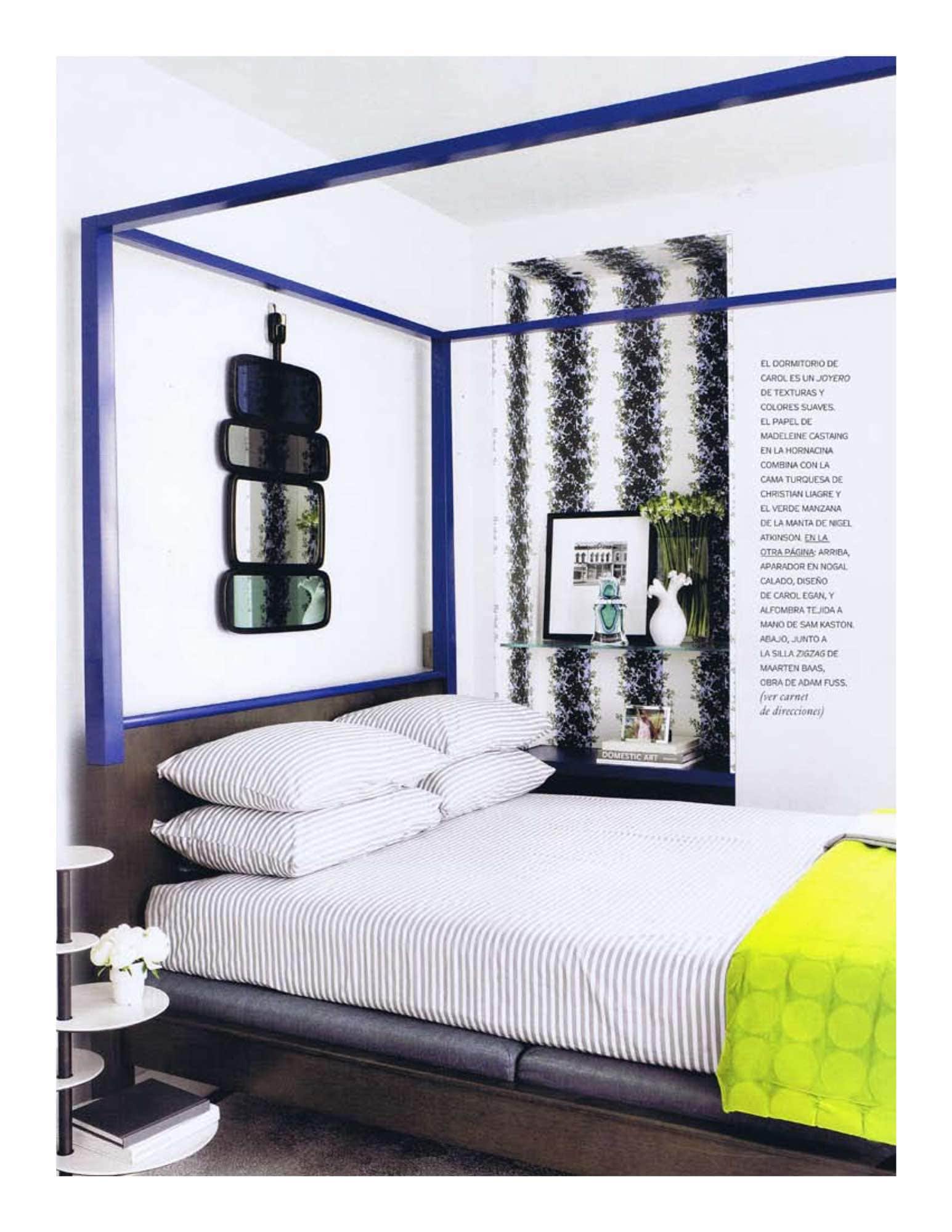 An image of a bedroom designed by Carol Egan with Zanzibar bed by Christian Liaigre, custom throw by Nigel Atkinson, Country mirror by Hubert Le Gall and Brunschwig & Fils Rayure Fleurie fabric by Madeleine Castaing.