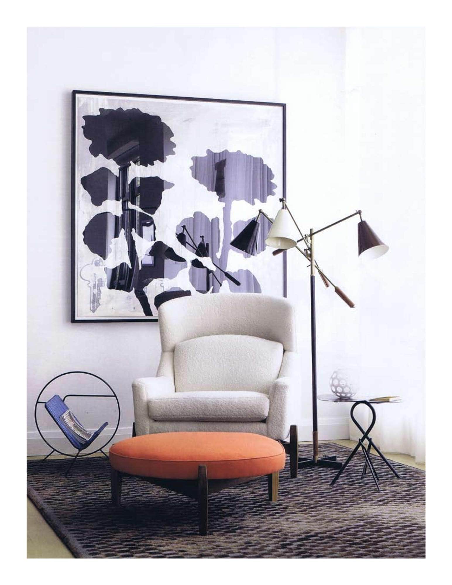 This image, designed by Carol Egan, shows "Big Chair" by Jens Risom, round ottoman by Jens Risom, workshop bronze OP elliptical table from Blackman Cruz Antiques and vintage 1970s magazine holder by Espasso on a silk & sisal are rug by Tai Ping Carpets.