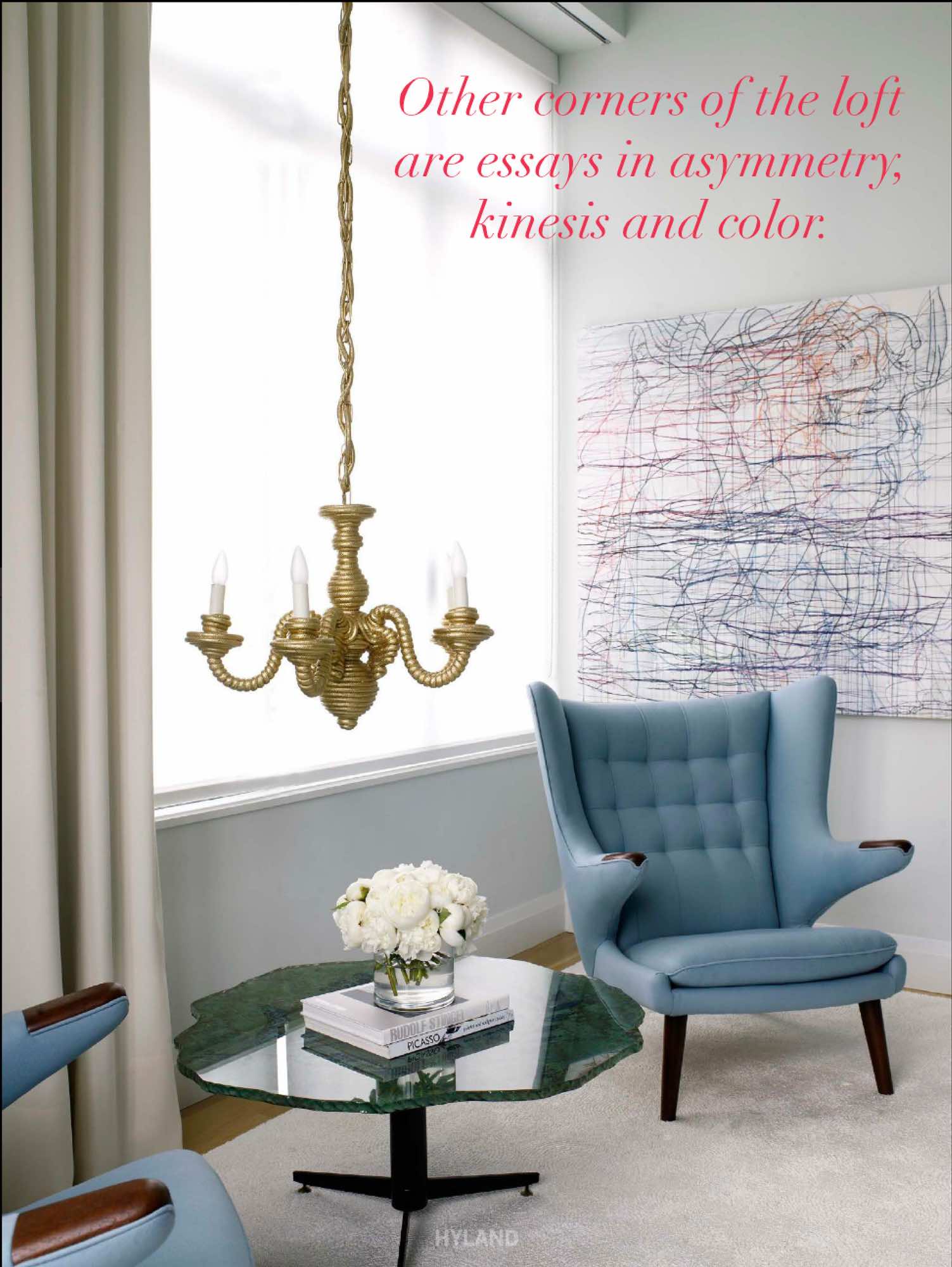 An image of the Papa Bear armchair by Hans J Wegner, 1955 painted glass Italian coffee table and Artwork by Ghaba Amer in the master bedroom designed by Carol Egan Interiors.